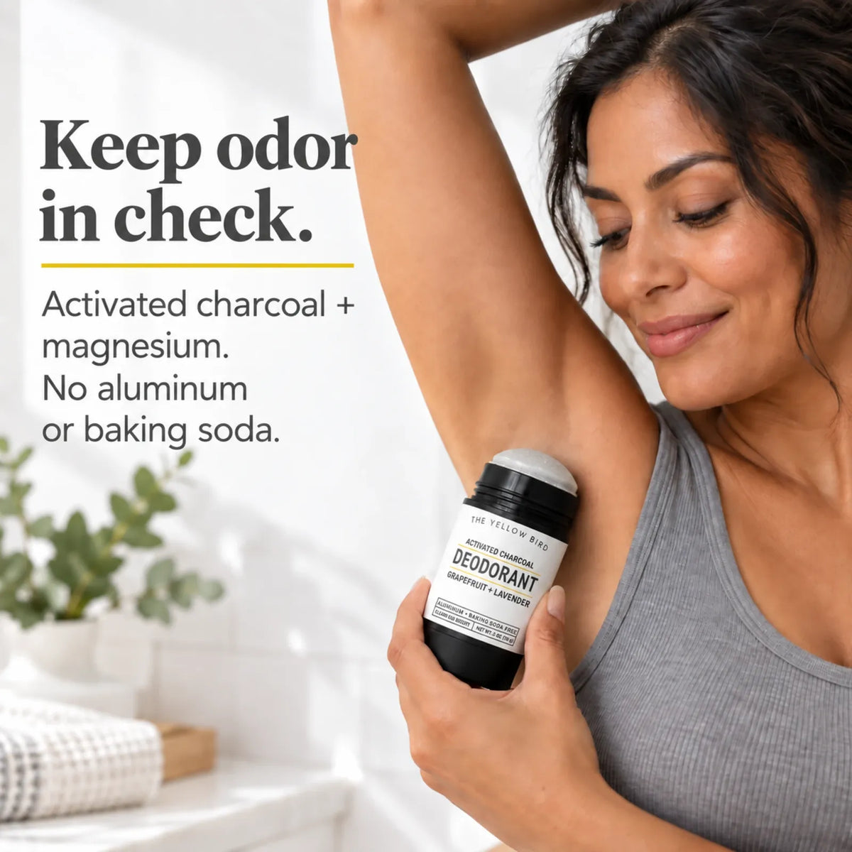 Woman applying aluminum-free activated charcoal and magnesium deodorant for natural odor control