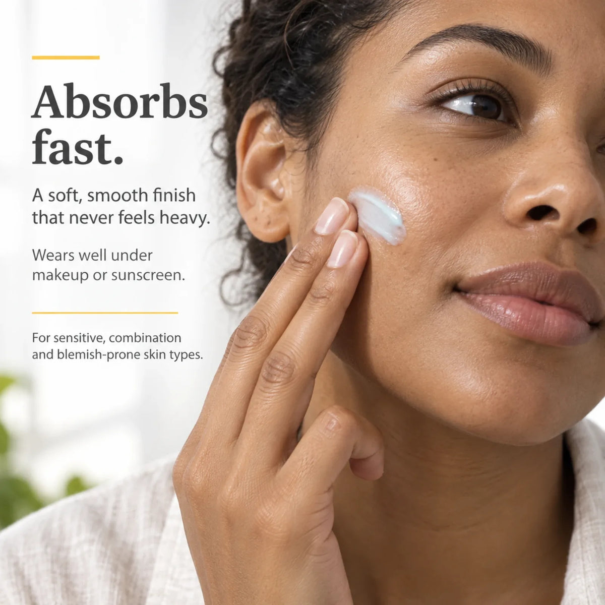 Woman smoothing Blue Tansy Face Cream onto her cheek; absorbs fast and wears well under makeup or sunscreen
