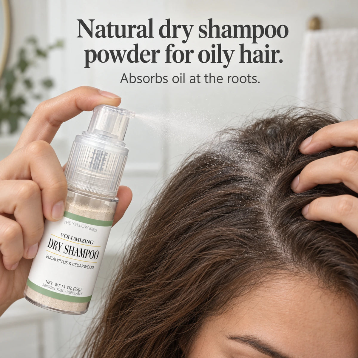 Natural dry shampoo powder for oily hair being puffed onto roots from the Eucalyptus Cedarwood pump bottle by The Yellow Bird