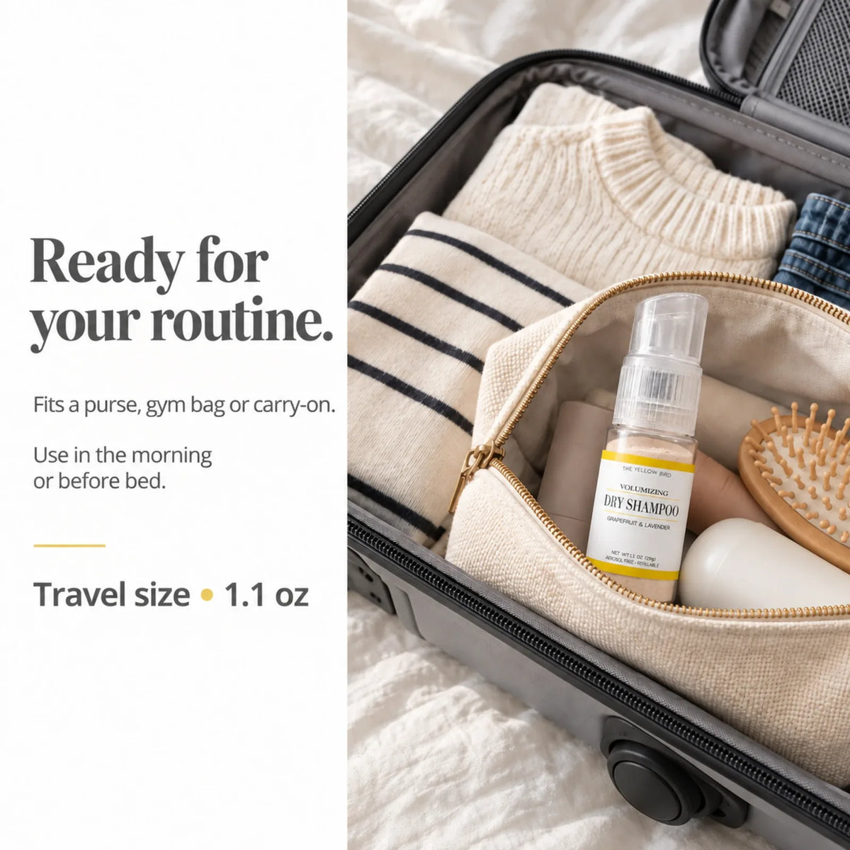 Travel size 1.1 oz Grapefruit Lavender dry shampoo packed in a toiletry bag inside a carry-on suitcase